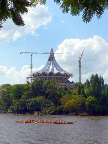 paddling past unfinished Assembly building